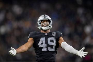 Raiders defensive end Charles Snowden (49) amps up the crowd during the second half of an NFL g ...