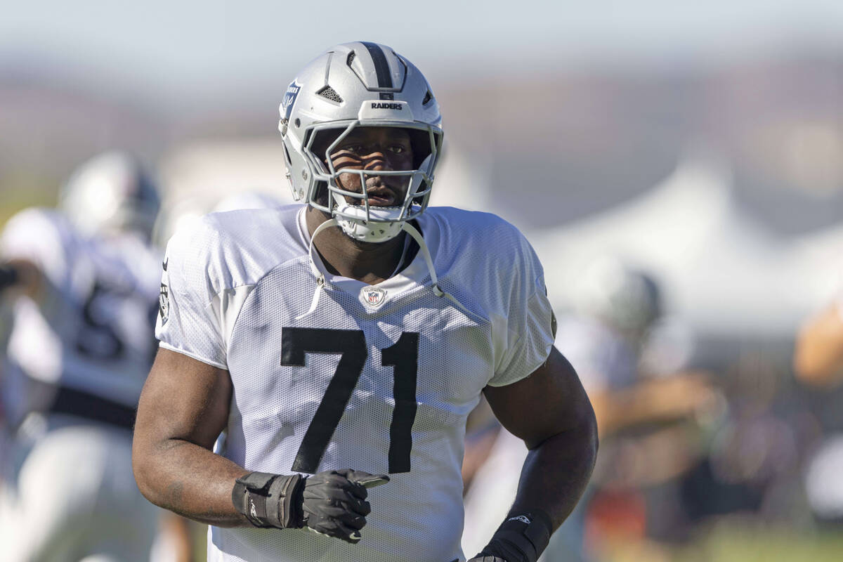 Raiders offensive tackle DJ Glaze (71) runs on the field during the team’s training camp ...