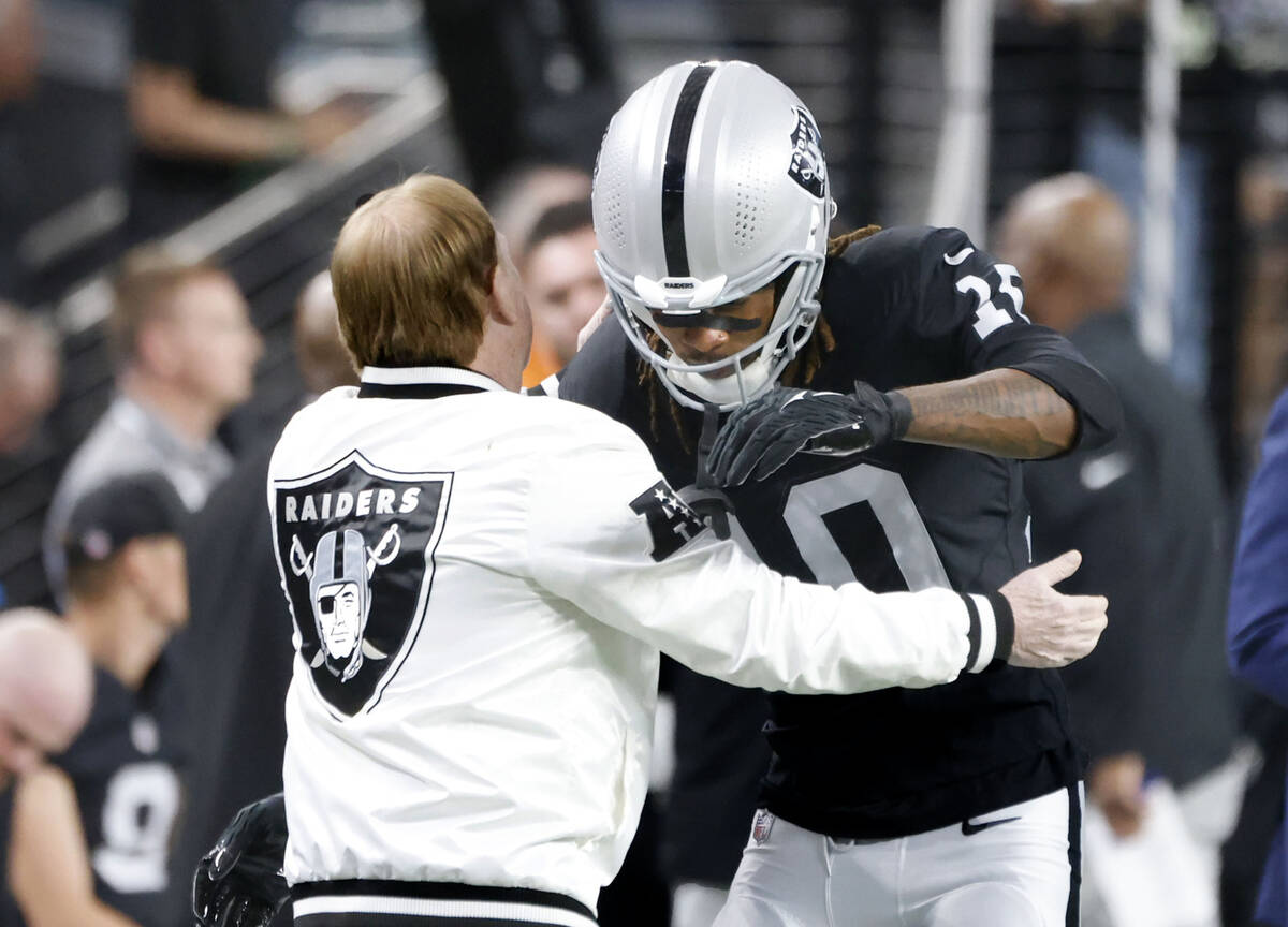 Raiders owner Mark Davis and Raiders wide receiver Dont'e Thornton Jr. (10) greet each oth ...