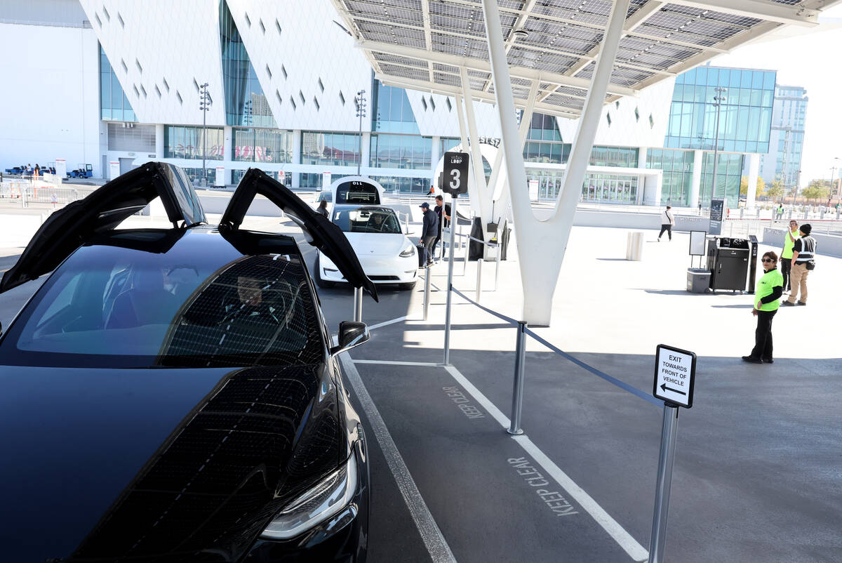 Vegas Loop workers stand ready to help conventioneers at the Las Vegas Convention Center West S ...