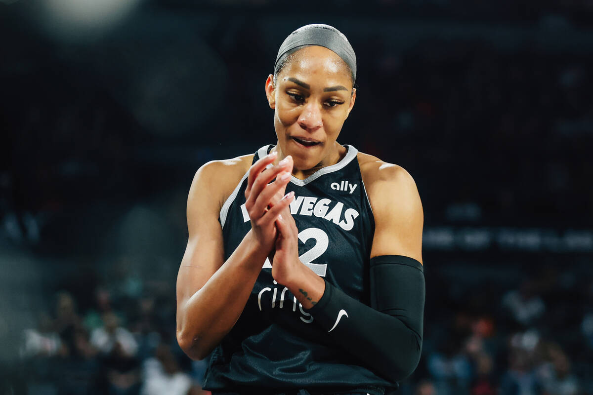 Aces center A'ja Wilson (22) celebrates drawing a foul during game three of a first round ...