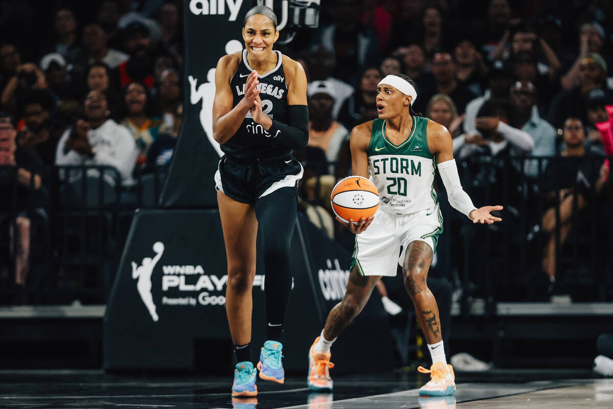 Aces center A'ja Wilson (22) celebrates as Seattle Storm guard Brittney Sykes (20) reacts ...
