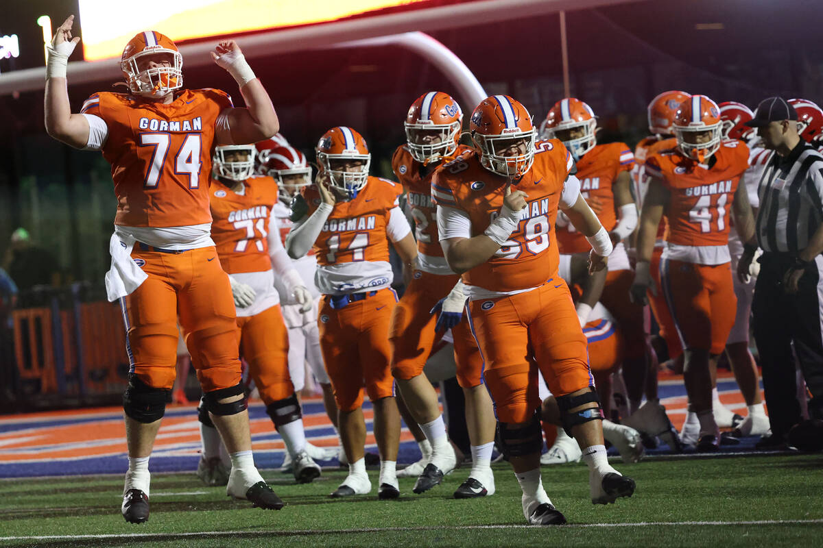 Bishop Gorman offensive lineman Devin Entsminger (74) celebrates with teammates after a first h ...