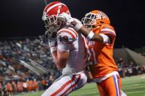 Mater Dei tight end Mark Bowman (19) makes a touchdown catch over Bishop Gorman defensive back ...