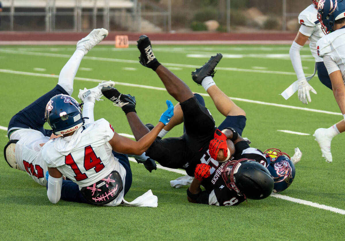 Desert Oasis’s Giovanni Corso (28) is taken down during a football game against Coronado ...