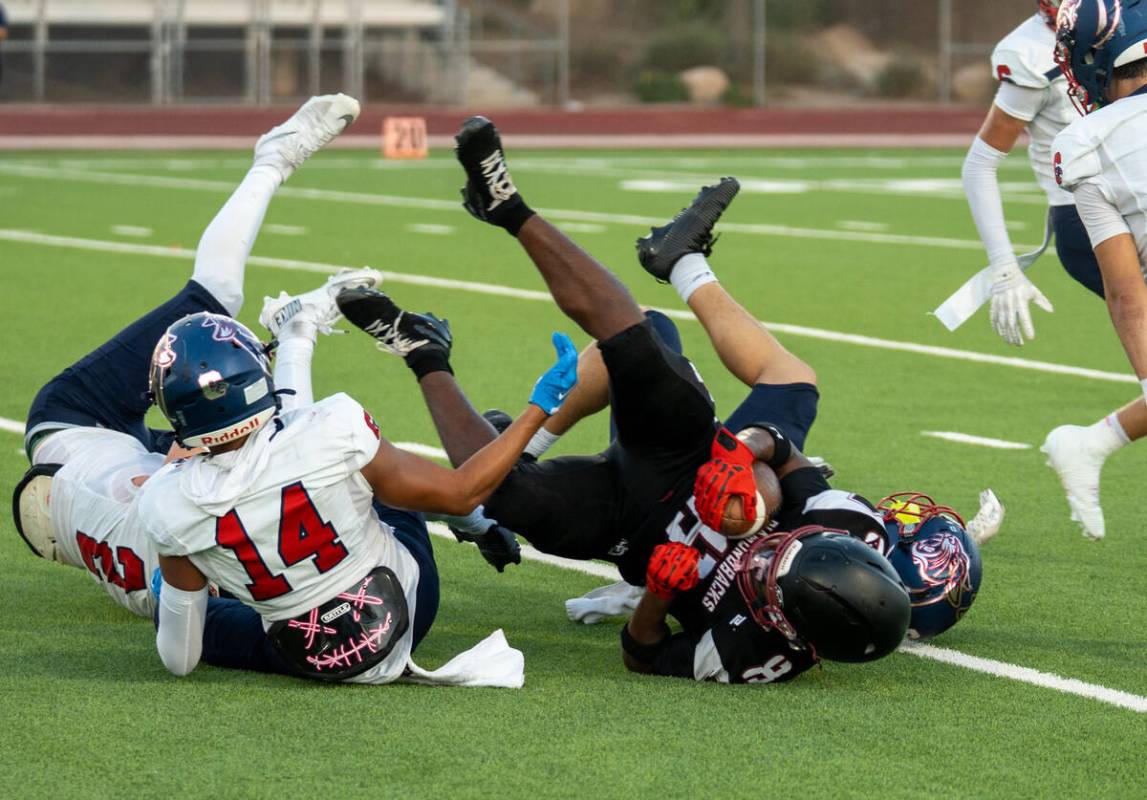 Desert Oasis’s Giovanni Corso (28) is taken down during a football game against Coronado ...