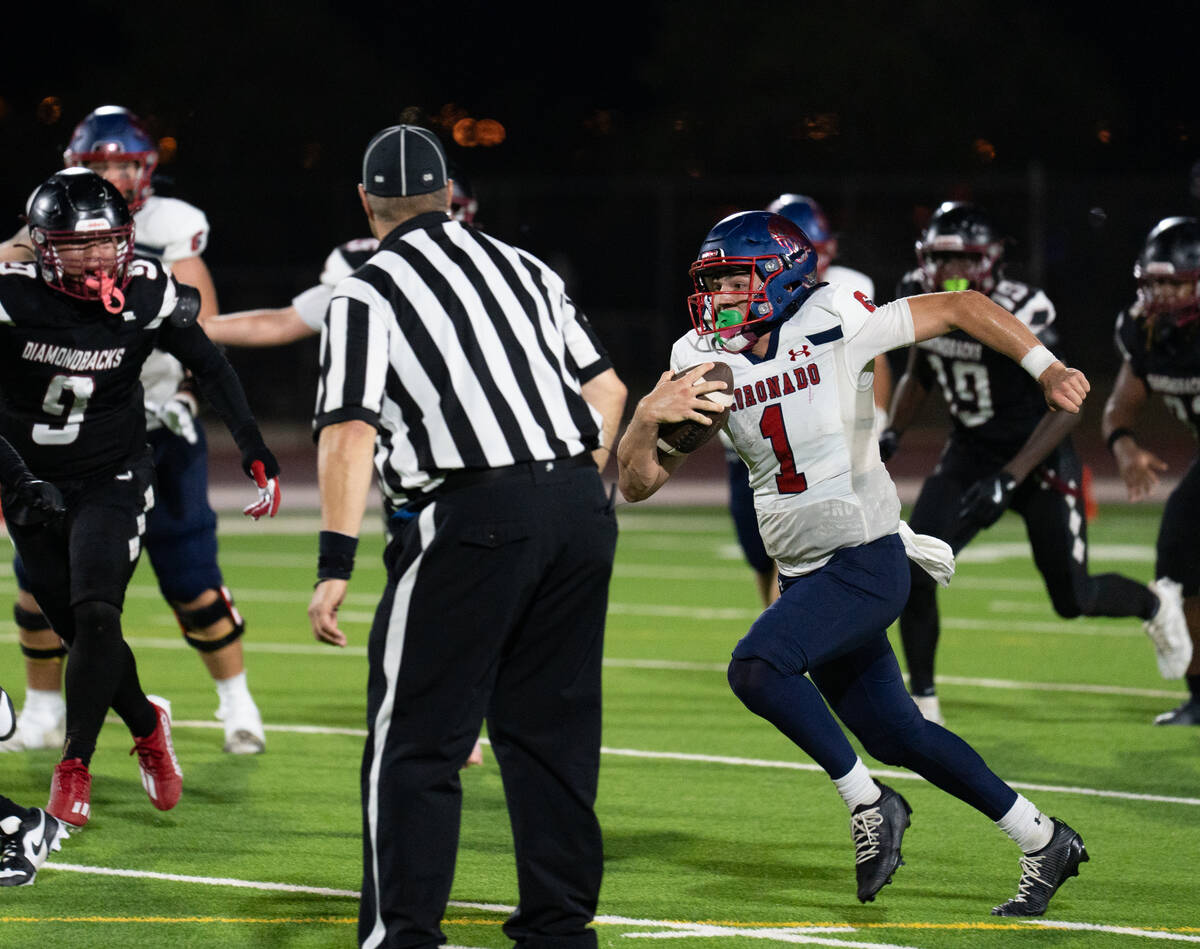 Coronado’s quarterback Jackson Humphries (1) looks for an open path during a football ga ...