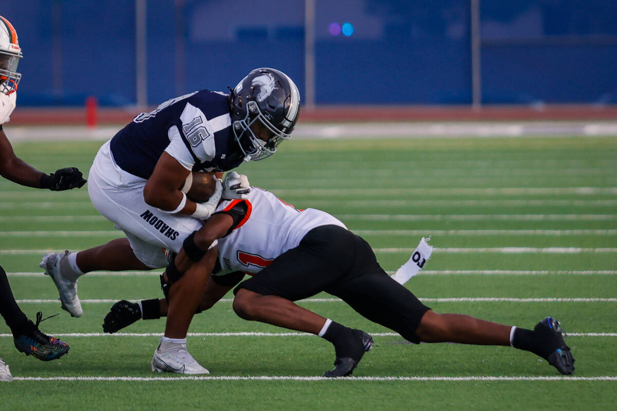 Shadow Ridge Isiah Jones (16) returns a kick-off during an NIAA Football game between Shadow Ri ...