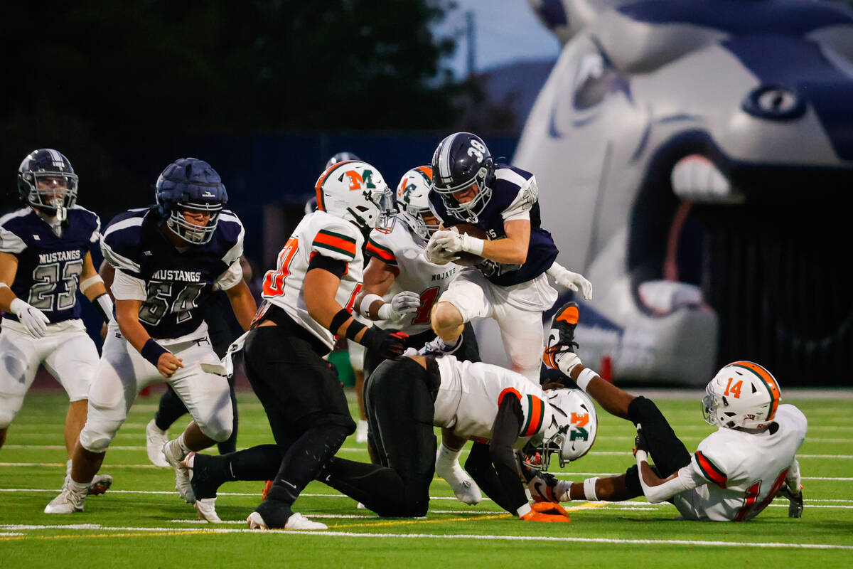 Shadow Ridge running back Hawkin Ledingham (38) runs the ball during an NIAA Football game betw ...