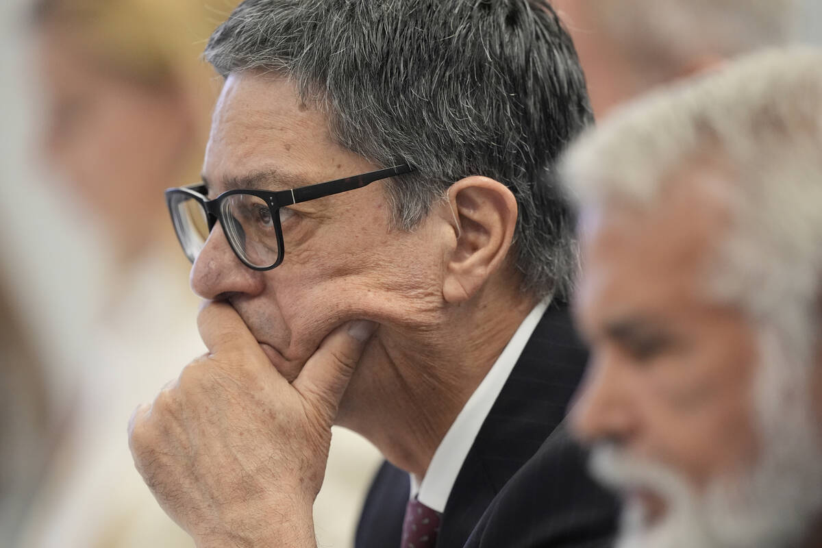 Committee member Dr. James Pagano listens during a meeting of the Advisory Committee on Immuniz ...