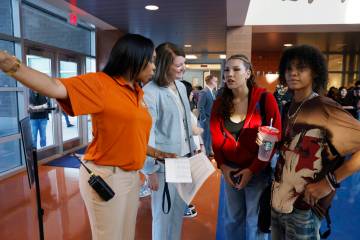 Legacy High School principal Belinda Marentic, left, directs students to their new classroom as ...