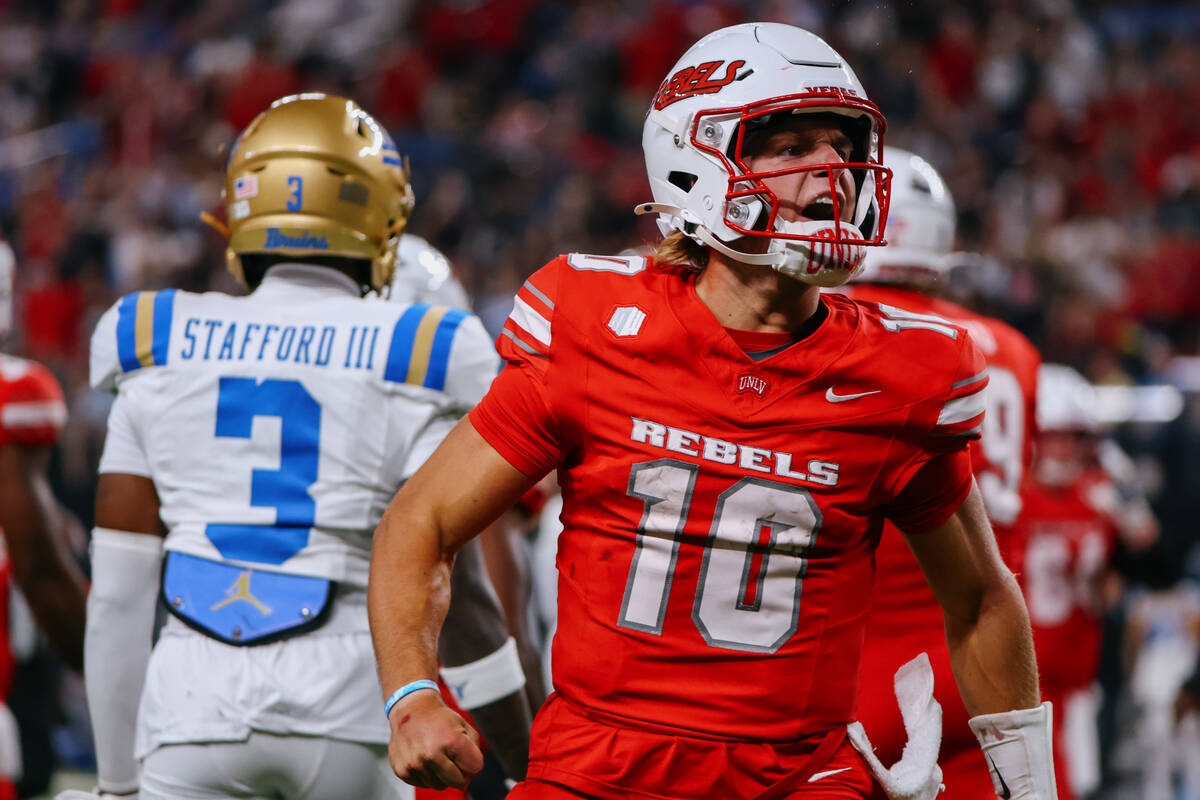UNLV quarterback Anthony Colandrea (10) celebrates a run upfield during second half of the foot ...