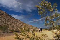 July Pabon and Armando Morelo hike a trail at Lone Mountain Regional Park Wednesday, June 4, 20 ...