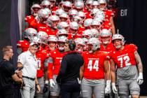UNLV head coach Dan Mullen waits at the bottom of the tunnel with his team while prepared for t ...