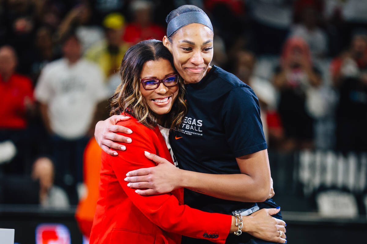 Aces center A'ja Wilson, right, hugs Aces president Nikki Fargas before game one of a roun ...