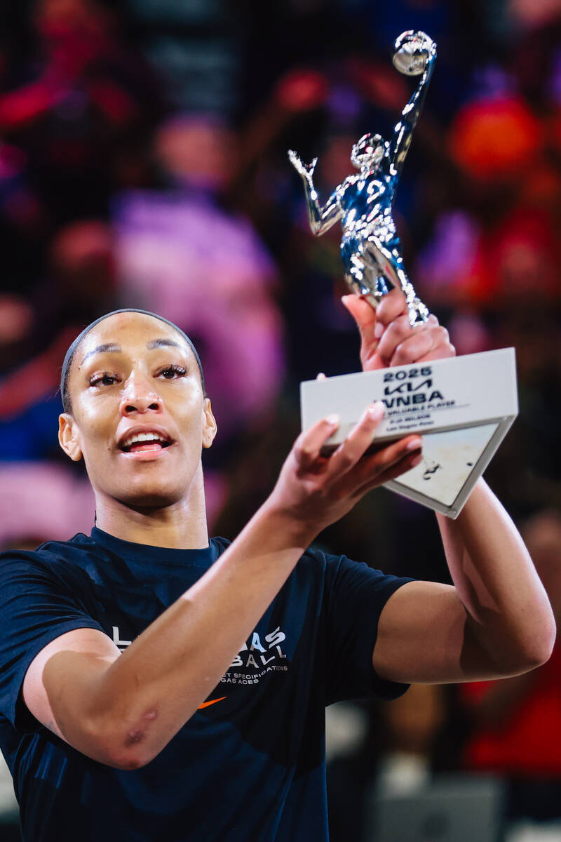 Aces center A'ja Wilson holds up her MVP trophy before game one of a round two WNBA playof ...