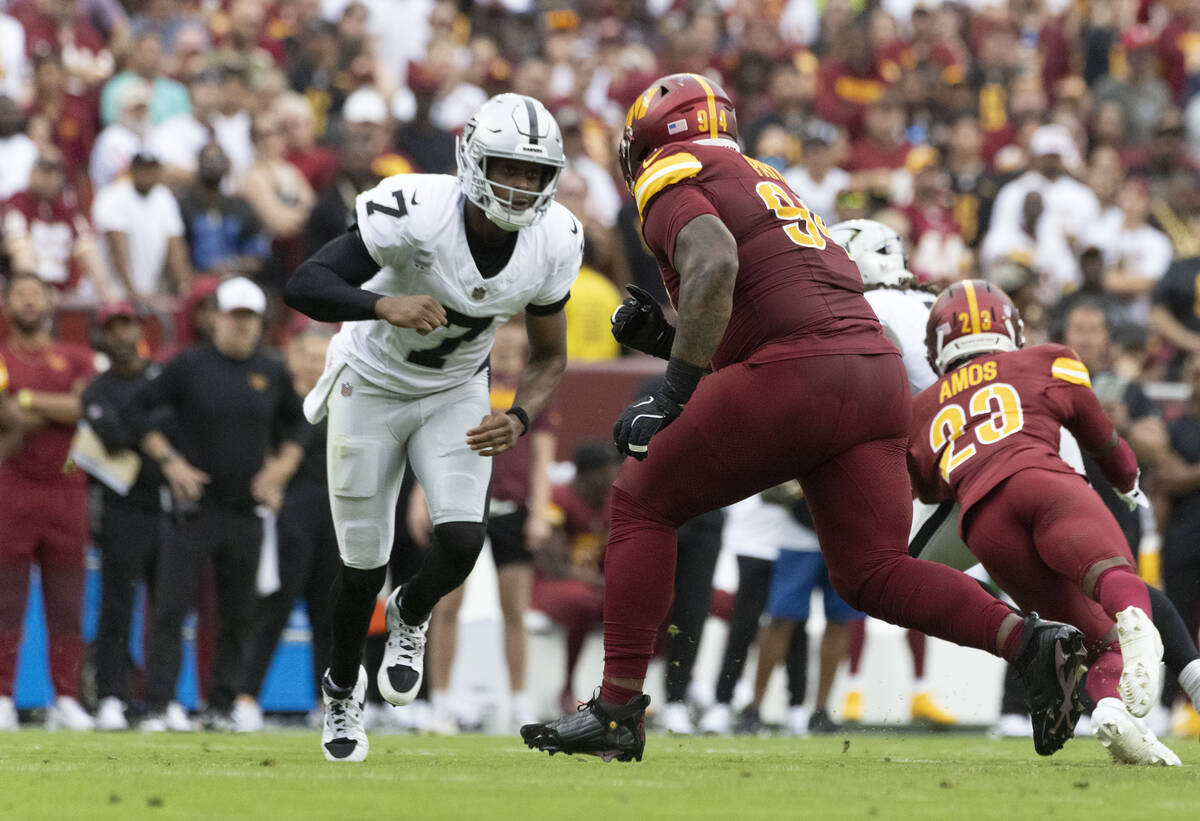 Raiders quarterback Geno Smith (7) goes out to block against Washington Commanders nose tackle ...