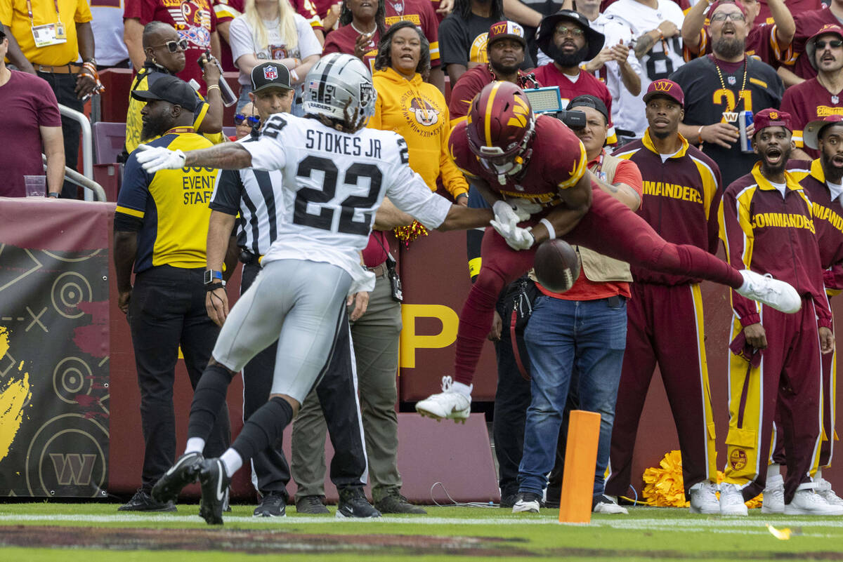 Raiders cornerback Eric Stokes (22) defends against Washington Commanders wide receiver Chris M ...