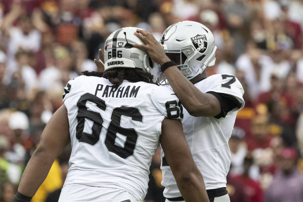 Raiders quarterback Geno Smith (7) celebrates his touchdown pass to Tre Tucker, not pictured, w ...