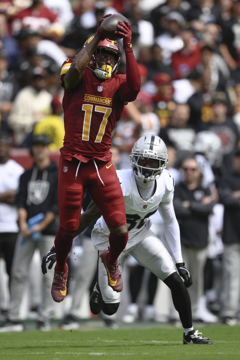 Washington Commanders wide receiver Terry McLaurin (17) catches the ball as Las Vegas Raiders c ...