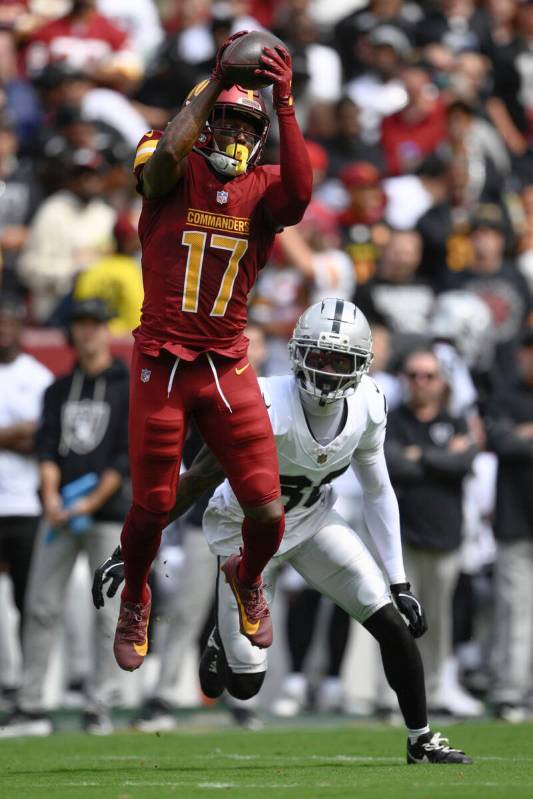 Washington Commanders wide receiver Terry McLaurin (17) catches the ball as Las Vegas Raiders c ...