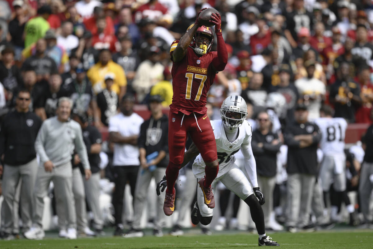 Washington Commanders wide receiver Terry McLaurin (17) catches the ball as Las Vegas Raiders c ...