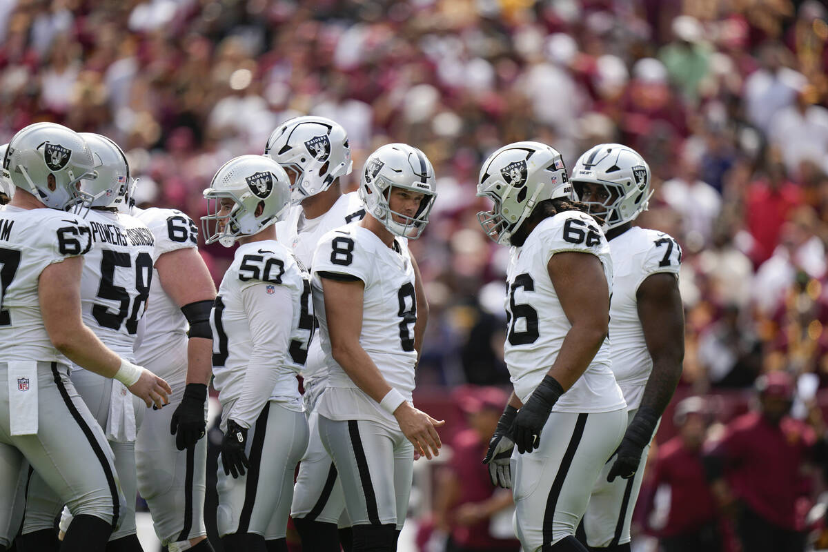 Las Vegas Raiders place-kicker Daniel Carlson (8) celebrates with teammates after a field goal ...