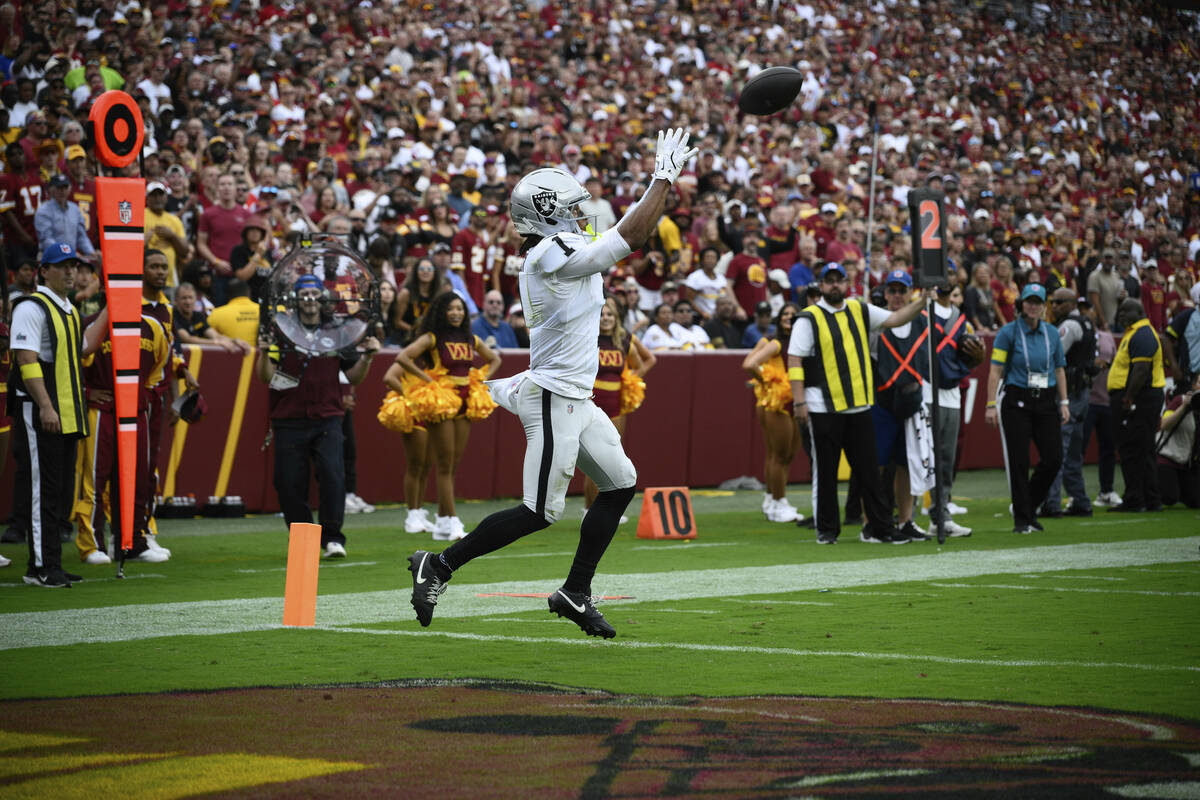 Las Vegas Raiders wide receiver Tre Tucker (1) scores a touchdown during the first half of NFL ...
