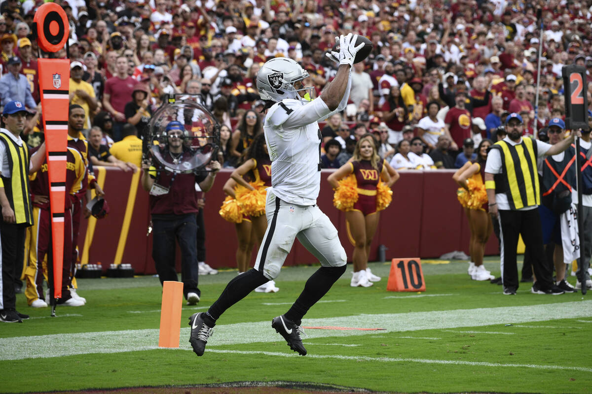 Las Vegas Raiders wide receiver Tre Tucker (1) scores a touchdown during the first half of NFL ...