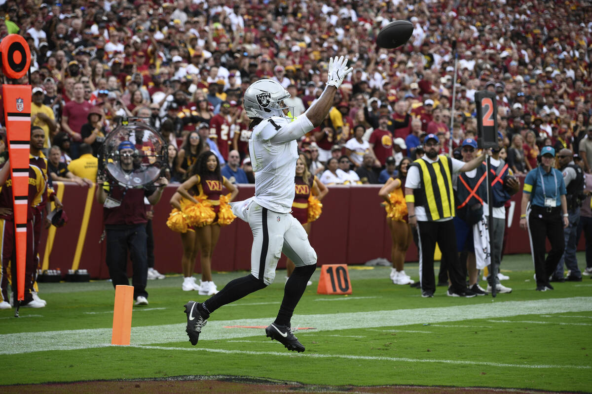 Las Vegas Raiders wide receiver Tre Tucker (1) scores a touchdown during the first half of NFL ...