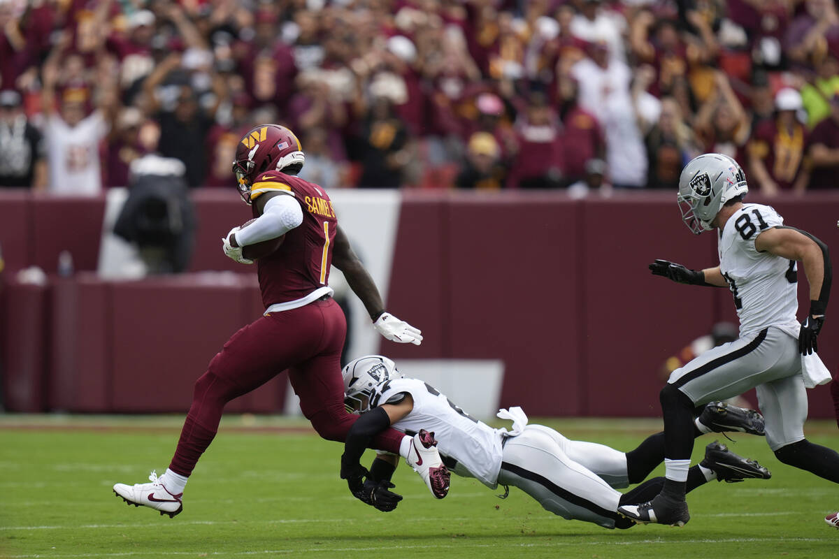 Washington Commanders wide receiver Deebo Samuel (1) runs with the ball during the first half o ...
