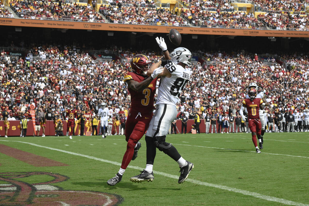 Washington Commanders safety Will Harris (3) breaks up a pass intended for Las Vegas Raiders ti ...