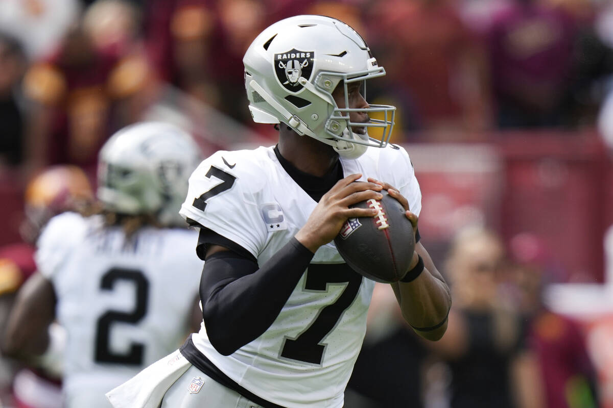 Las Vegas Raiders quarterback Geno Smith (7) looks to throw during the first half of NFL footba ...