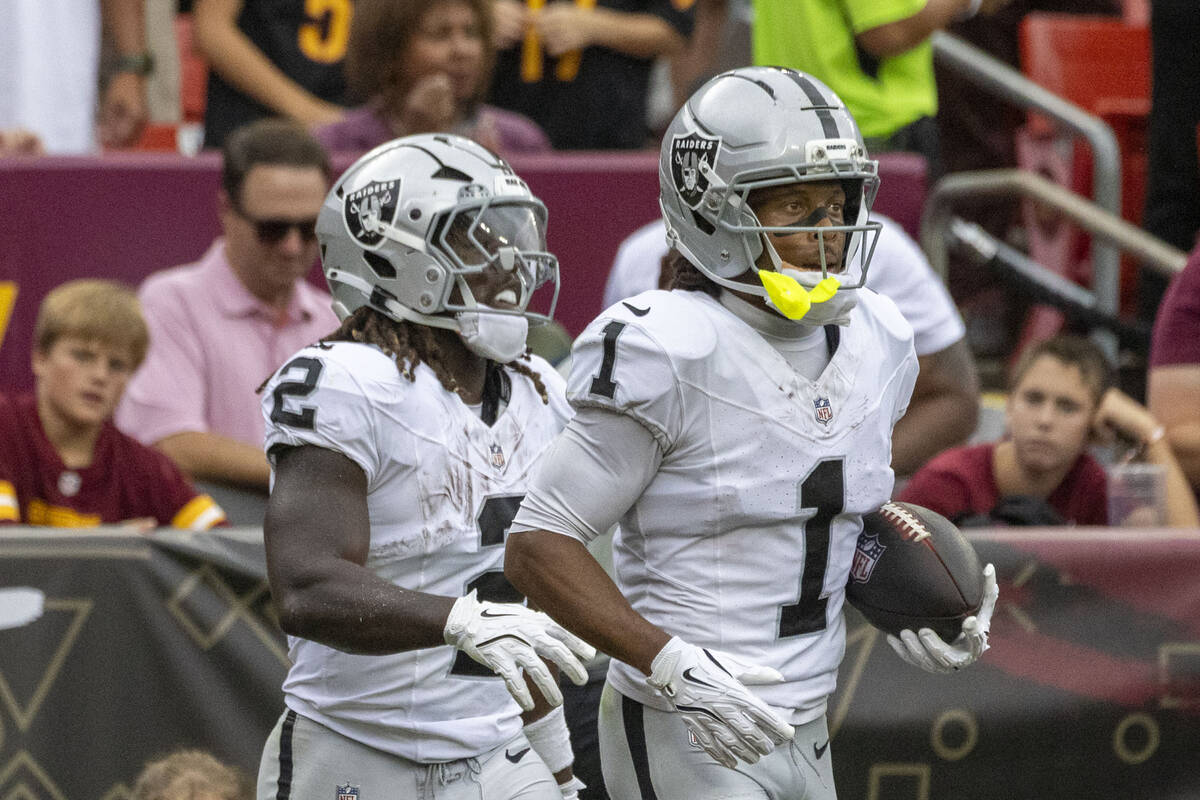 Raiders wide receiver Tre Tucker (1) runs out of the end zone after scoring a touchdown as runn ...