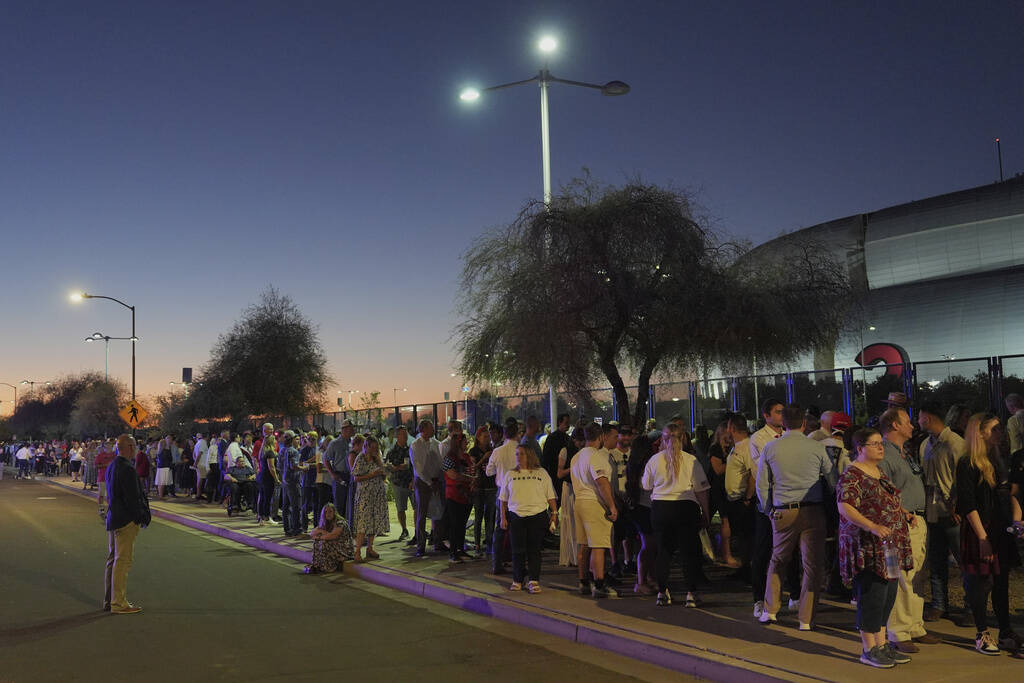 People wait in line before a memorial for conservative activist Charlie Kirk Sunday, Sept. 21, ...