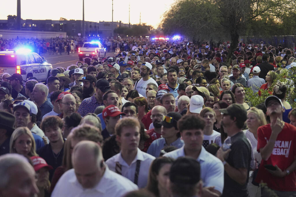 People wait in line before a memorial for conservative activist Charlie Kirk Sunday, Sept. 21, ...