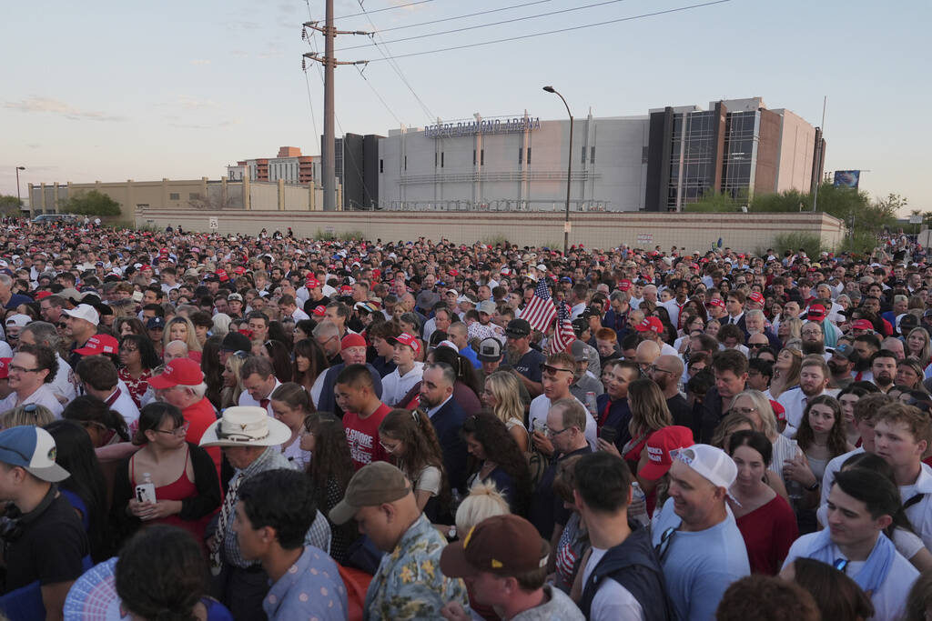People wait in line before a memorial for conservative activist Charlie Kirk Sunday, Sept. 21, ...