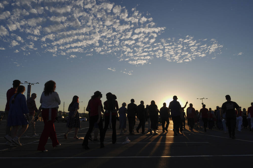 People wait in line before a memorial for conservative activist Charlie Kirk Sunday, Sept. 21, ...