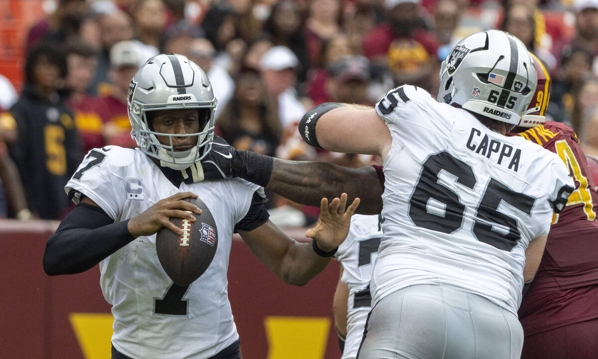 Washington Commanders nose tackle Daron Payne (94) reaches into sack Raiders quarterback Geno S ...