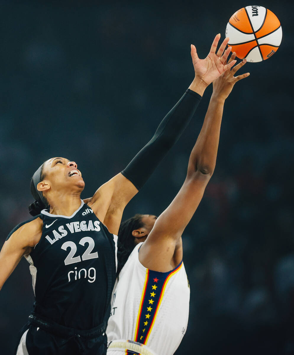 Aces center A'ja Wilson (22) reaches for the ball during tip off in game one of a round tw ...