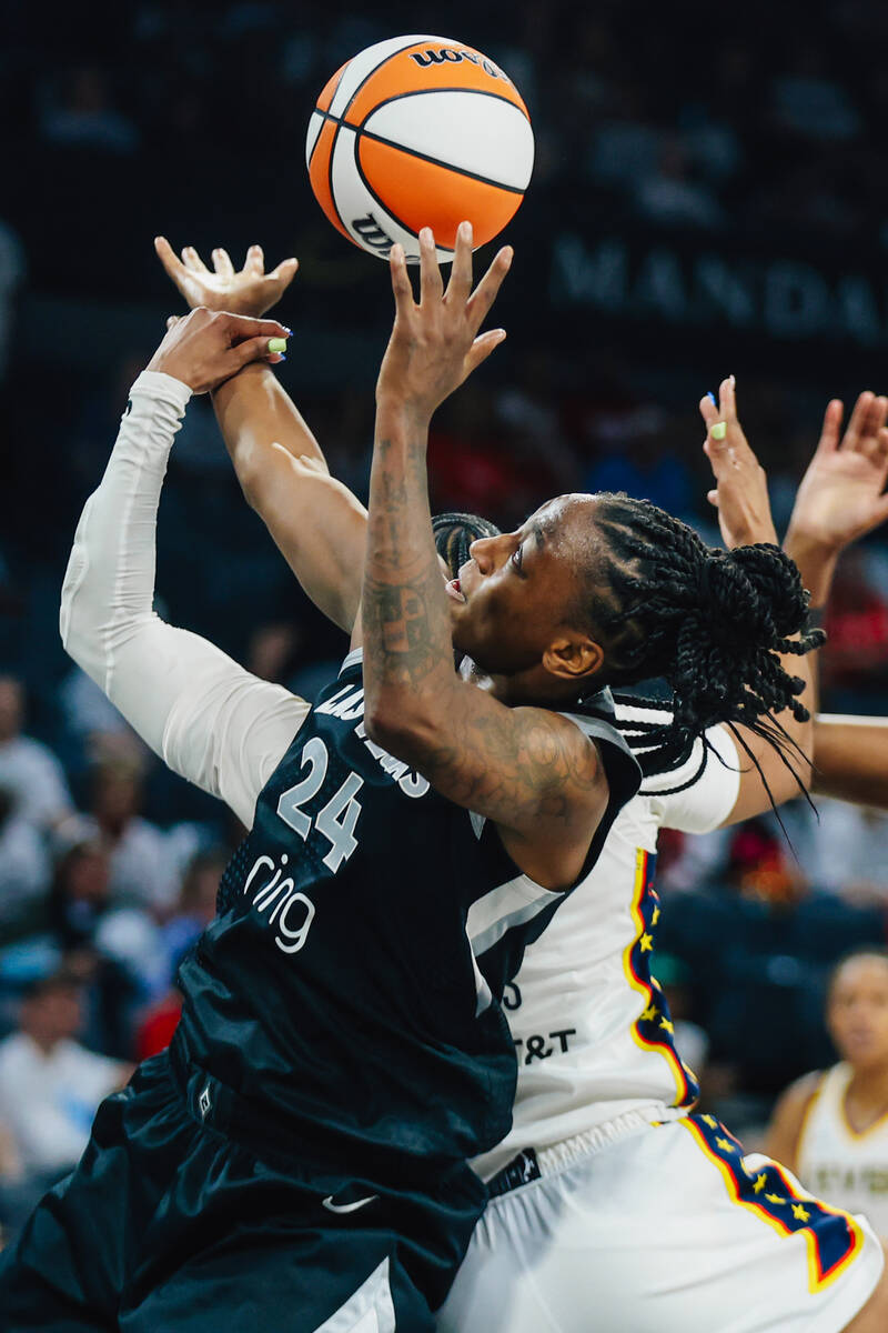 Aces guard Jewell Loyd (24) fights for a chance to shoot the ball during game one of a round tw ...