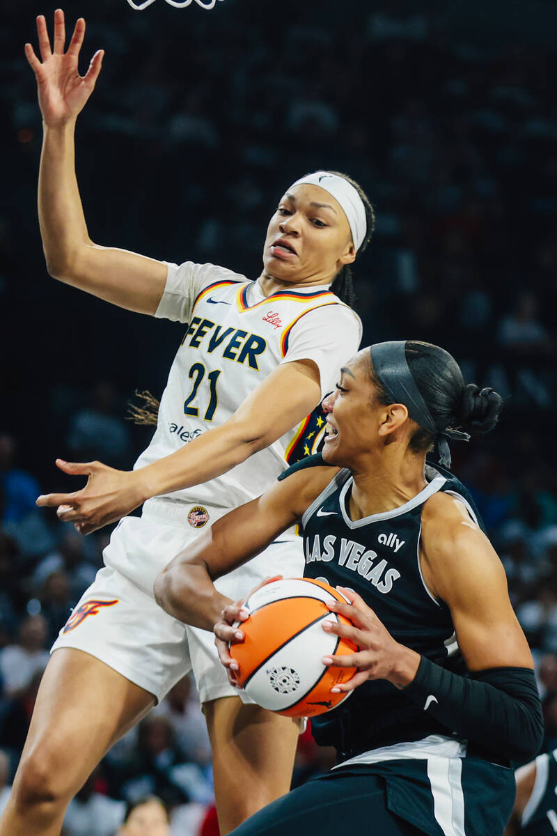 Aces center A'ja Wilson (22) looks to pass the ball during game one of a round two WNBA pl ...
