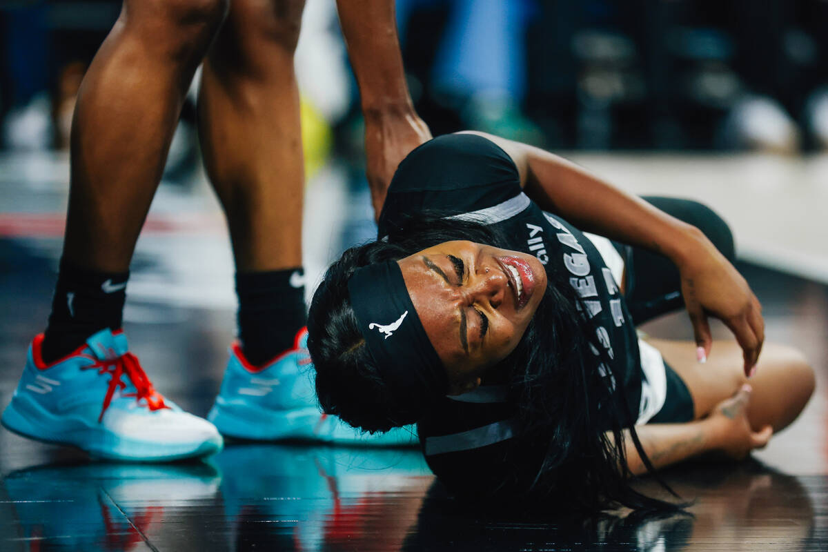 Aces guard Dana Evans reacts to an injury before shaking it off during game one of a round two ...
