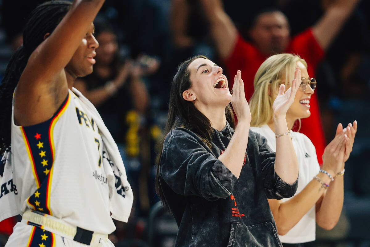 Indiana Fever guard Caitlin Clark celebrates her team winning game one of a round two WNBA play ...