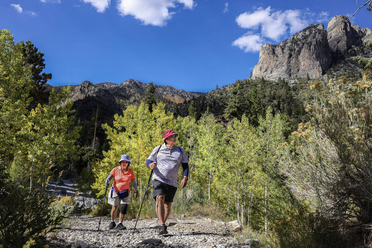 Gary and Rosell Ng, from Alexandria, Va., hike along the Echo Trail Monday, Sept. 22, 2025 on M ...