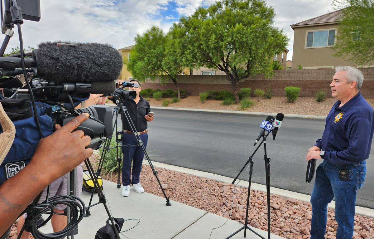 Lt. Robert Price speaks to the media about a homicide investigation in the far northwest valley ...