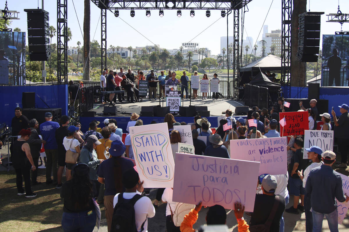 Supporters gather around a stage during an immigration rally on Saturday, Sept. 20, 2025, in Lo ...