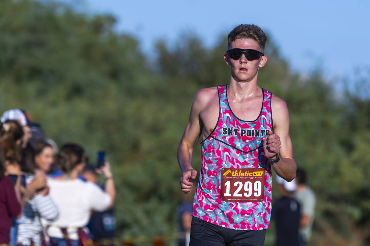Somerset Academy Sky Pointe High School runner Carter Prater (1299) nears the finish to ta ...