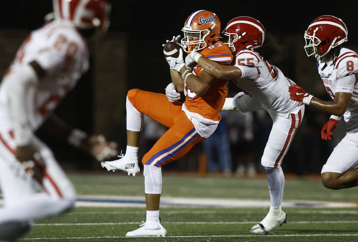 Bishop Gorman wide receiver Damari Hall (83) is tackled by Mater Dei defender Ezekiel Su’a (5 ...