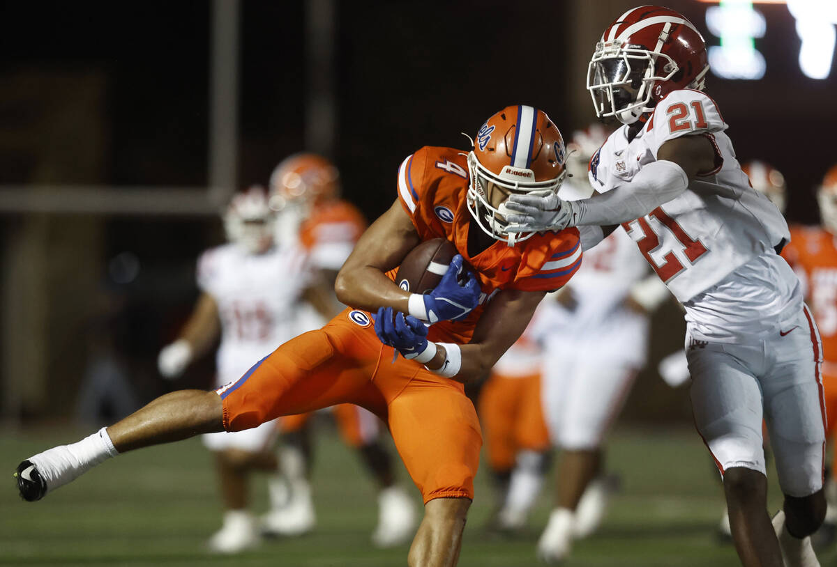 Bishop Gorman wide receiver Kaina Watson (4) makes a catch over Mater Dei defensive back Aaryn ...